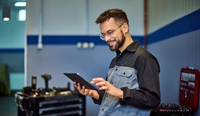 Picton business owner checking payroll on a tablet